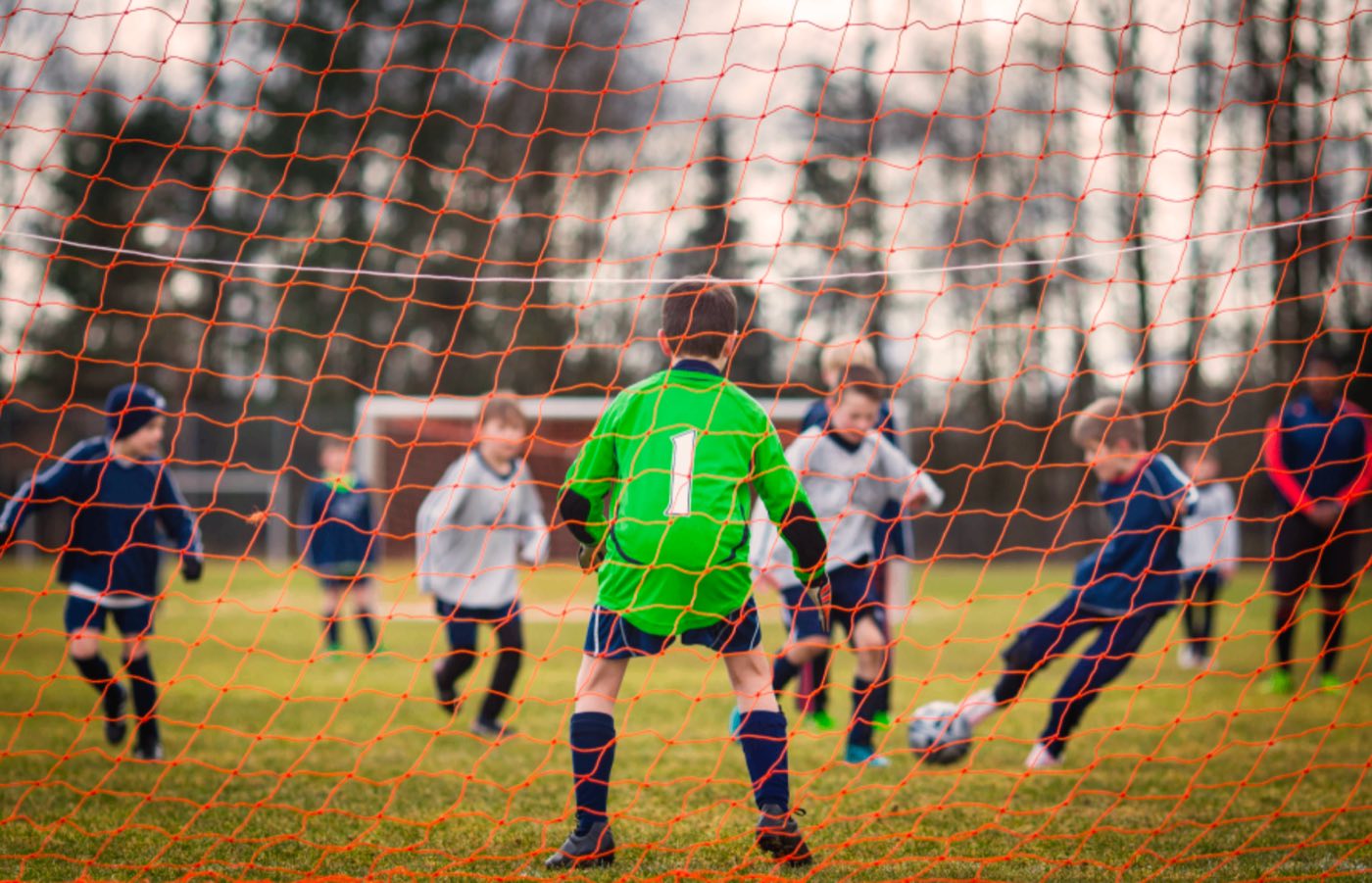 A youth match seen from behind the goal